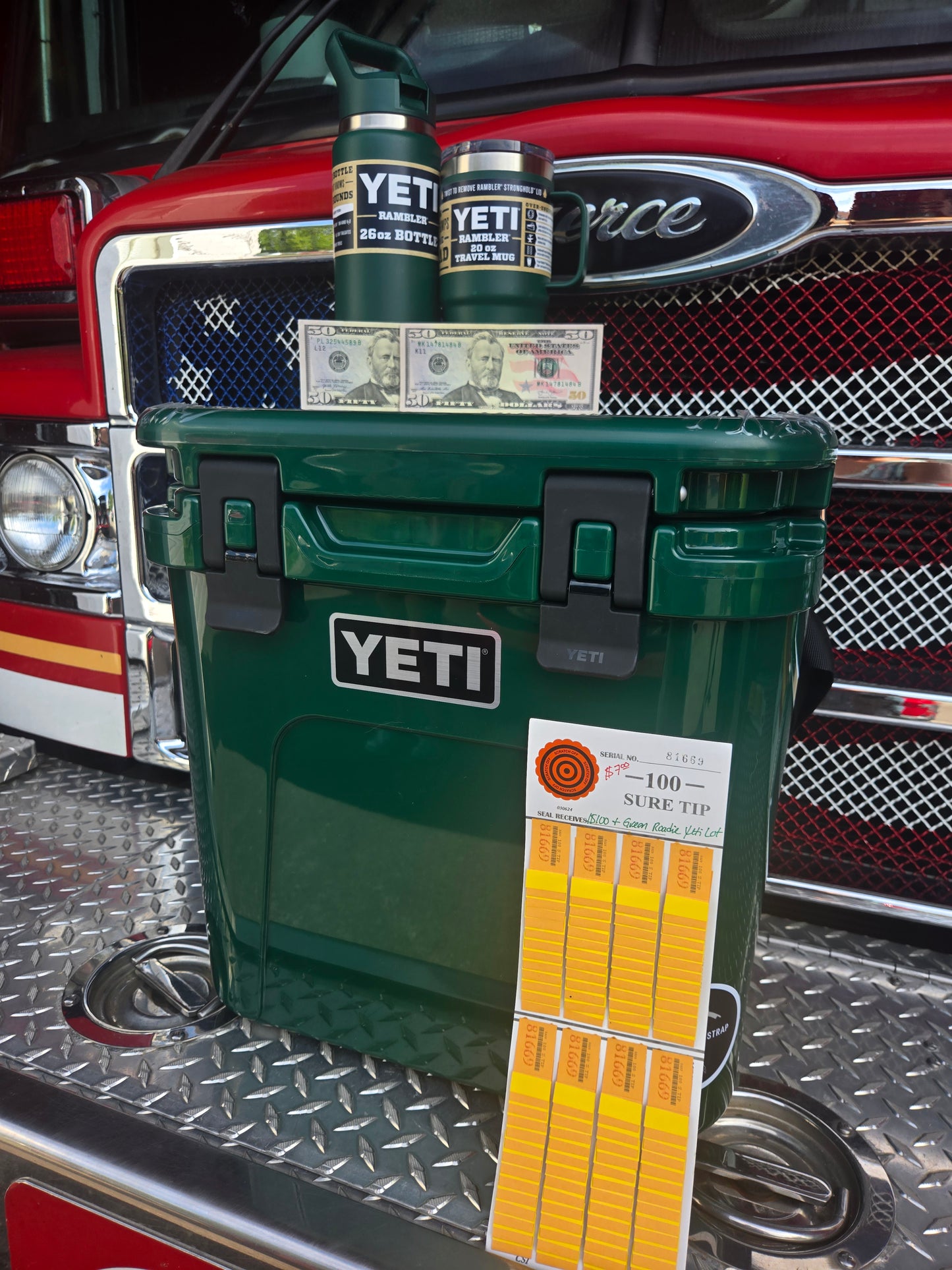 $100 & Green Roadie Yeti cooler and cups serial # 81669