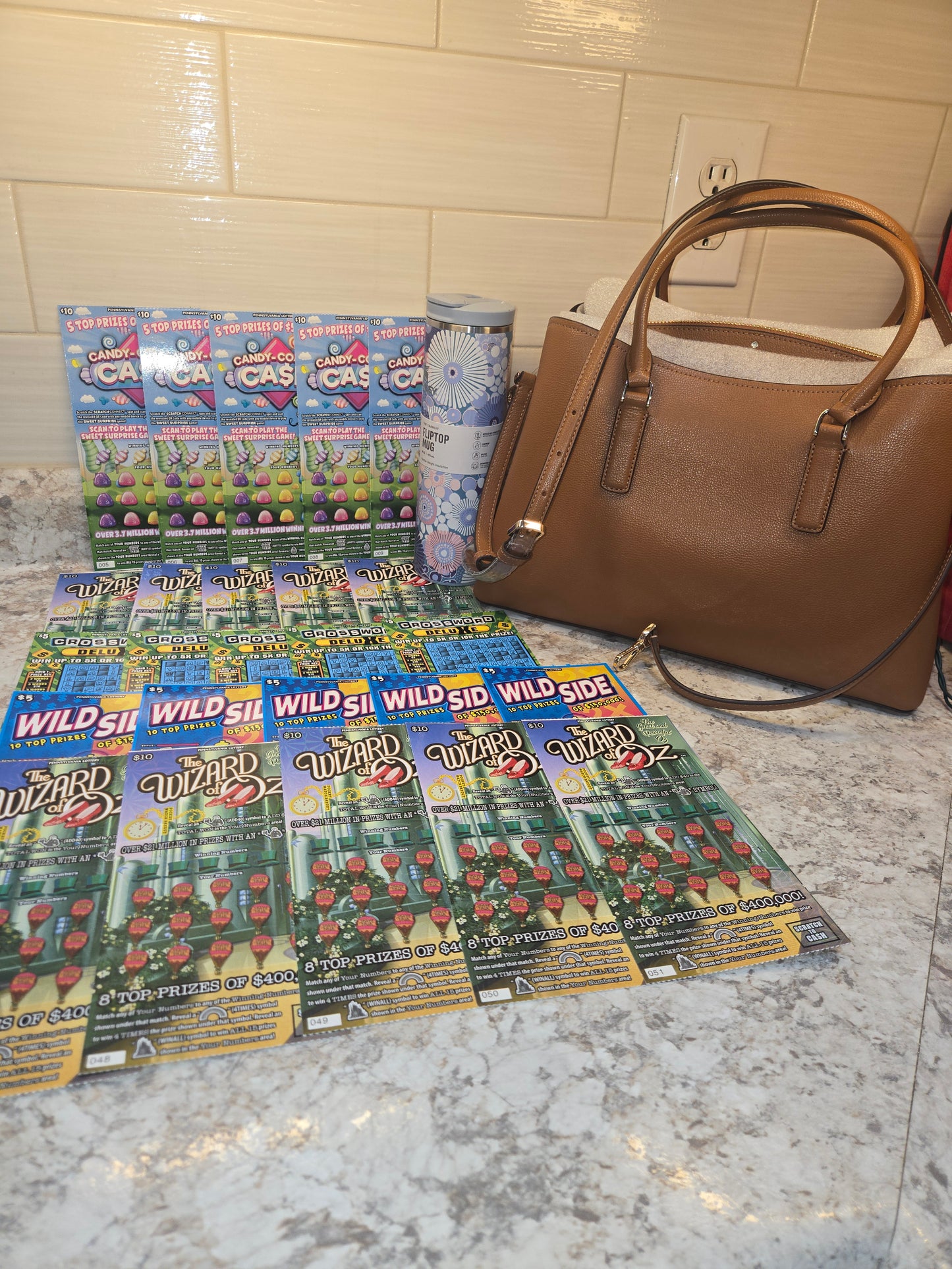 $200 Lotto's, Blue Wildflower Stanley, brown Kate Spade serial # 14307